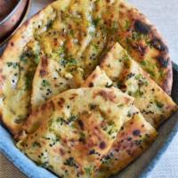 1 Paneer Kulcha · Vegetarian- Leavened flat bread stuffed with cottage cheese and seasoned with spices