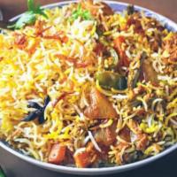 Vegetable Dum Biryani · Vegetarian- Basmati rice cooked with assorted vegetables and traditional herbs  and spices.