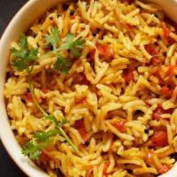 Tomato Rice · Vegan & vegetarian- Steamed rice cooked with tomatoes and spices.