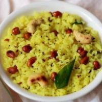 Lemon Rice · Vegan & Vegetarian- Steamed rice mixed with a spiced lemon and peanut mixture.