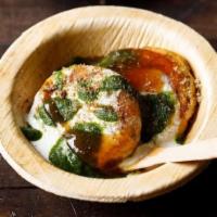 Aloo Tikki Chat · Vegetarian- Fried potato patties topped with tangy tamarind sauce and spicy green chutney al...
