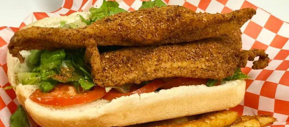 Catfish Sandwich · 2 filleted catfish fried til golden & cajun fries. Comes with lettuce, tomatoes, pickles, mayo and homemade remoulade sauce.