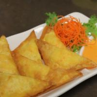 4.  Crab Cream Cheese · Fried pastry filled with a blend of cream cheese and imitation crabmeat and served with swee...