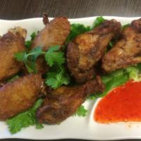 6. Thai Fried Chicken Wings · Marinated and deep fried wings served with sweet chili sauce.