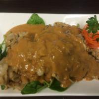 31. Thai Peanut Sauce Noodles · Stir fried wide rice noodles and eggs served with sauteed spinach topped with Thai peanut sa...