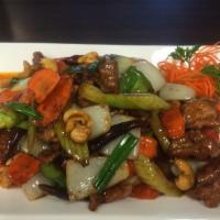 34. Golden Cashew · Stir fried with cashew nuts, chili paste, onions, bell peppers, carrots and mushrooms. Spicy.