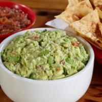 Chips and Guacamole · Basket of fresh tortilla chips seasoned with Fuzzy Dust, and served with guacamole salad.