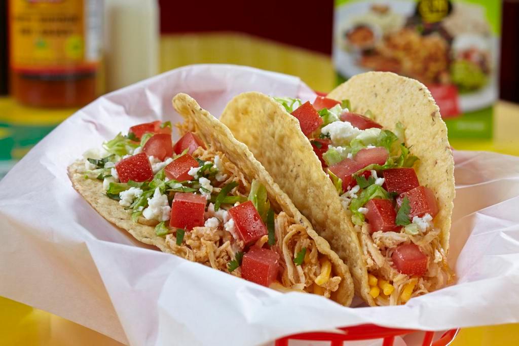 Grilled Fish (Mahi) Taco · Grilled mahi mahi fish served on a soft corn tortilla and topped with garlic sauce, lettuce, tomatoes, shredded cheese, cilantro and feta.