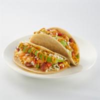 California Heat Taco · Tempura battered shrimp, bacon, avocado, feta, shredded cheese, pico de gallo, and Sriracha-...