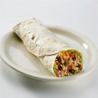 Shredded Brisket Burrito · Stuffed with guacamole, shredded cheese, tomatoes, onions, garlic sauce and your choice of r...