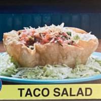 Taco Salad · Crispy flour tortilla bowl filled with rice, cheese, beans, lettuce tomatoes, avocado and so...
