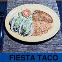 Fiesta Taco Plate · Corn tortilla filled with your choice of meat, lettuce guacamole, and cheese. Includes rice ...