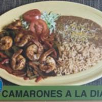 Camarones A La Diabla · Seasoned shrimp cooked with hot sauce just delicious. Includes rice and beans.
