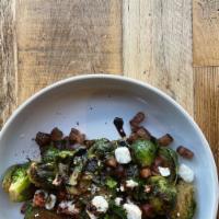 Crispy Brussels Sprouts · Anchovy butter, smoked pork belly, dried chili’s, crumble goat cheese, balsamic reduction ; ...