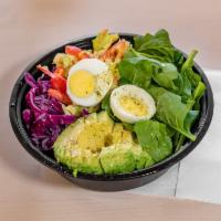 The Yolo Bowl · Brown rice, spinach, red cabbage, avocado, slaw and egg. Substitution tofu salad for vegan o...