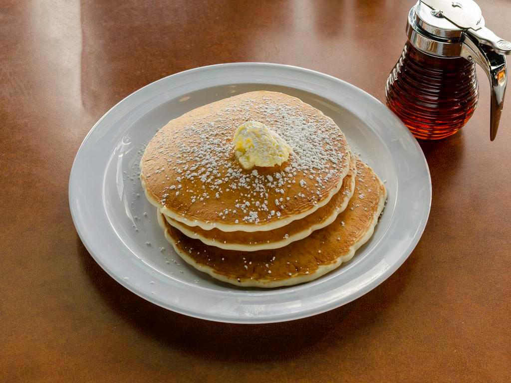 Pancake Breakfast · 2 pancakes, 2 eggs, and 2 bacon or sausage.