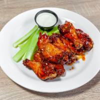 Honey Chili Glaze Wings · 8 wings, tossed in honey chili glaze sauce, served with blue cheese & celery