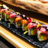 The Real Deal Roll · Spicy crunch salmon and avocado roll inside, topped with toro and king salmon and black tobi...