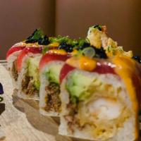 Kissimmee Roll · Lobster tempura, fried onion, avocado roll, wrapped with soy pepper. Seared tuna & spicy may...