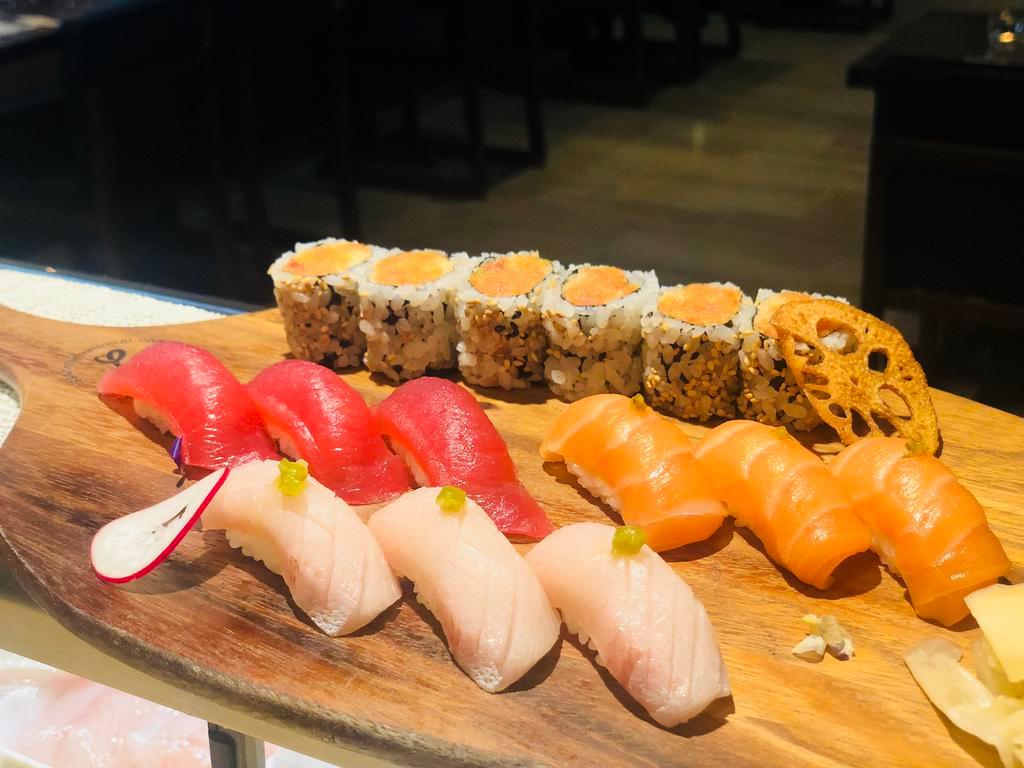 Tri Color Sushi · 3 pieces tuna, 3 pieces salmon, 3 pieces yellowtail & spicy crunch tuna roll.  Raw.