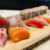 Sushi & Sashimi Combo · 9 piece sashimi & 5 pieces sushi with spicy tuna roll. Raw.