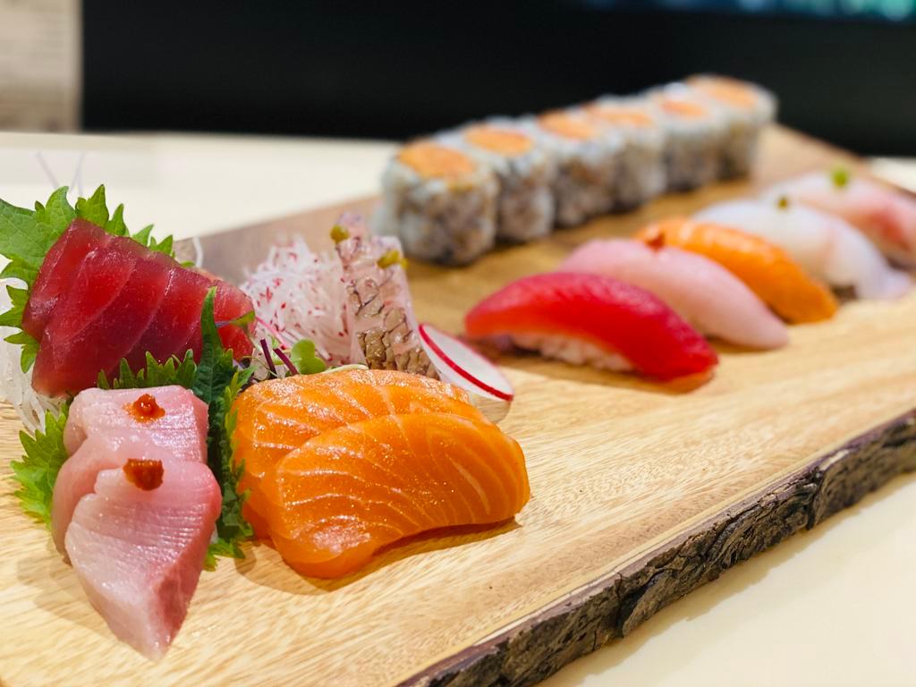 Sushi & Sashimi Combo · 9 piece sashimi & 5 pieces sushi with spicy tuna roll. Raw.