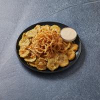 Fried Pickles · Dill pickle rounds, lightly breaded with seasonal white corn meal and served with chipotle h...