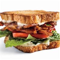 Club Sandwich · Sliced turkey, Swiss cheese, lettuce, tomatoes, bacon and Mayo on white toast served with fr...