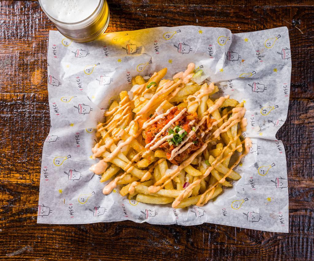 Kimchi Fries · Deep fried fries topped with onion, kimchi, scallion on the top
and spicy mayo on the side.