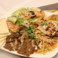 Combo Platter · Chicken, gyro, salad, rice, salata, tzatziki, hummus and pita bread.