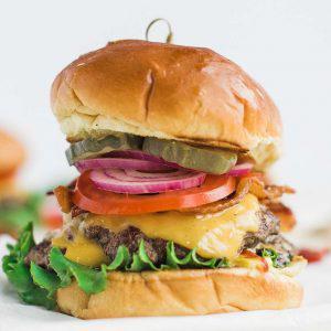 Classic Cheeseburger · Lettuce, 1000 island, patty, mayo pickles, onion and tomatoes.