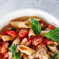 Tuna Tomato Confit Penne Pasta · Single origin ancient grain pasta, bronze cut in Italy. Penne pasta, pole caught tuna, confi...