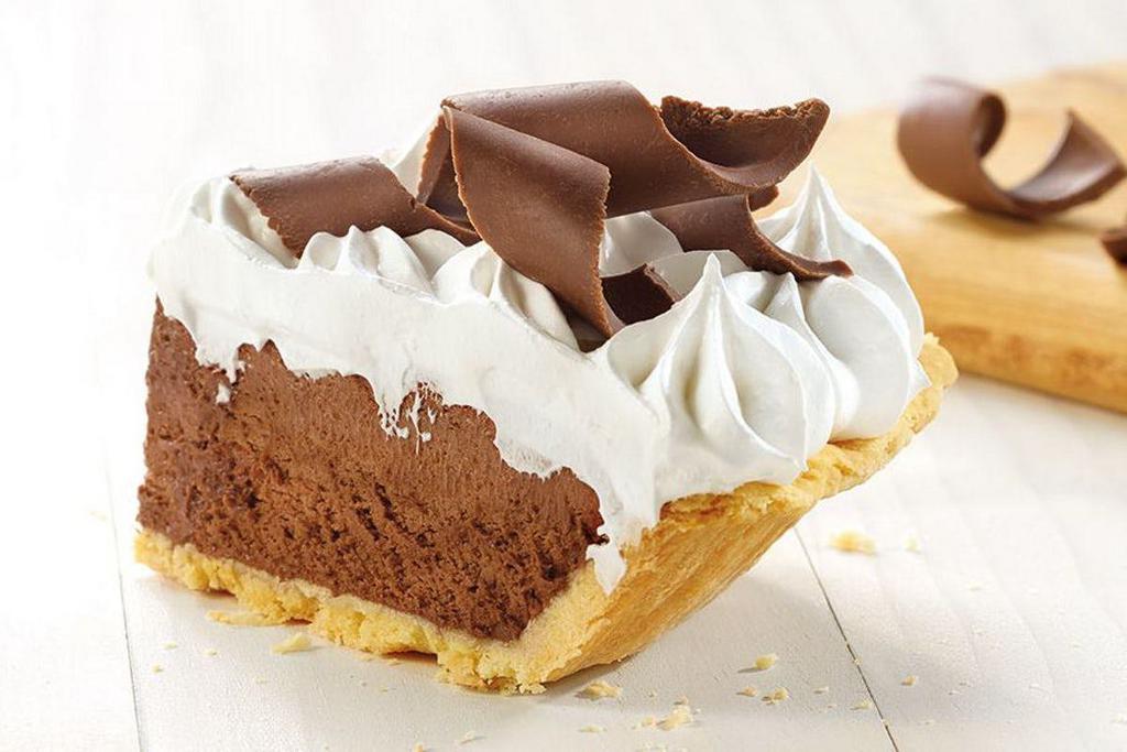 French Silk Pie Slice · Velvety smooth chocolate silk covered with real whipped cream and milk chocolate curls, inside our award-winning pastry crust.