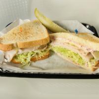 C10. Smooth Sailing · Juicy turkey, Swiss cheese, tomato, lettuce and cranberry cream cheese.