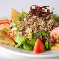 Lentil Fetoosh Salad · lentils and turmeric brown rice, caramelized onions, seasonal mixed greens, tomatoes, cucumb...