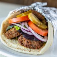 Falafel Pita · chickpea croquettes, tahini, seasonal mixed greens, tomatoes, red onions and pickles
