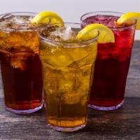 Freshly Brewed Iced Tea · Served with a choice of flavor.