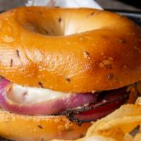 Ellis Island Hot Pastrami Sandwich · Bagel with Swiss cheese, grilled onions and mustard.  Served with pickle and chips.