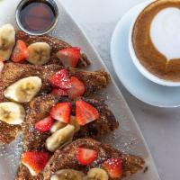 Multigrain French Toast  · Served with maple syrup, whipped butter, powdered sugar, and topped with bananas and strawbe...