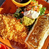 Super Burrito Loco  · Our biggest burrito. Stuffed with your choice of meat. Served with rice, refried beans, sour...