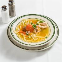 23. Sopa del Dia · Homemade chicken soup.