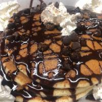 Chocolate Chip Pancakes · Buttermilk baked with chocolate chips and topped with whipped cream, chocolate sauce, and co...