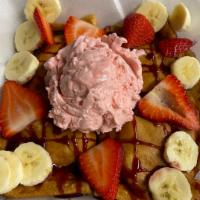 Crepes · Choice of fruit, banana, blueberries, peach with vanilla ice cream, whipped cream, and choco...