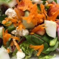 Mediterranean Salad · Mixed garden green with olives, tomatoes, feta cheese, onions, peppers, cucumbers, carrots a...