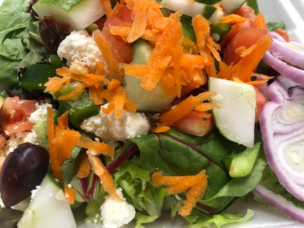 Mediterranean Salad · Mixed garden green with olives, tomatoes, feta cheese, onions, peppers, cucumbers, carrots and sun-dried tomatoes with olive oil, and balsamic vinaigrette.