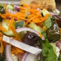 Greek Tavern Salad · Romaine lettuce with tomatoes, cucumbers, red onions, carrots, feta cheese, Kalamata olives ...
