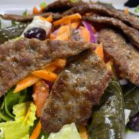 Gyro Salad · Chopped Greek salad with grilled gyro beef strips.