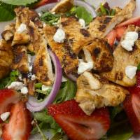 Strawberry Pecan Salad · Grilled chicken, mixed baby greens, sliced fresh strawberries, goat cheese, sliced onions, a...