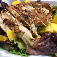 Tropical Salad · California spring mix with tomatoes, cucumbers, onions, sliced mango, tangerine, grilled chi...