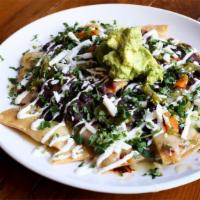 Nachos · Cheddar, jalapeno, black beans, guacamole, sour cream, green & red salsas.